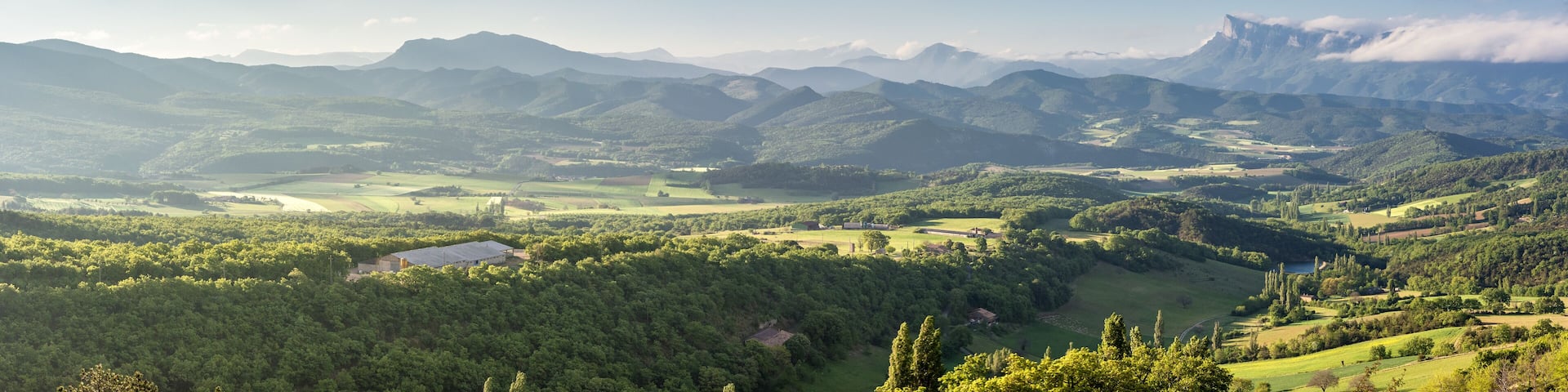 French countryside. View over the mountains (Trois Becs, Plateau des Chaux, Grand Barry et la Servelle) of the Drôme in France.