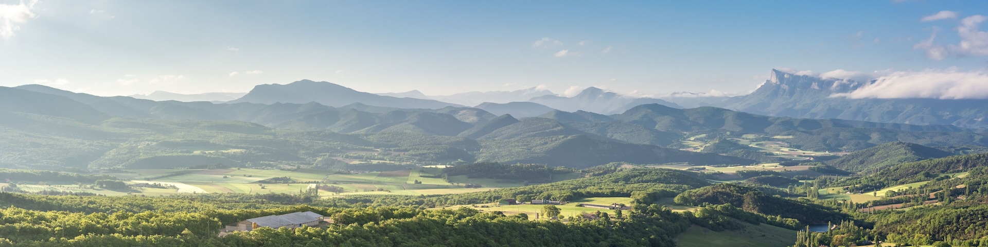 French countryside. View over the mountains (Trois Becs, Plateau des Chaux, Grand Barry et la Servelle) of the Drôme in France.