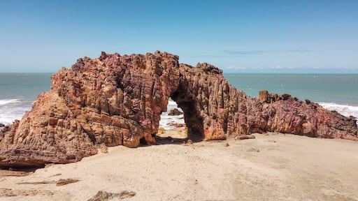 The ocean with its shades of colors in Jeriocoacoara in Brazil, the beach of Pedra Furada, the sand dunes and the long rocky coast