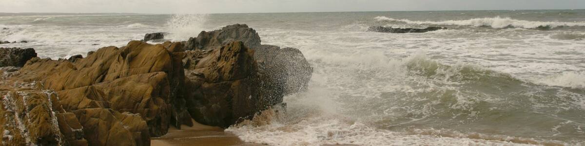 La Pedrera showing a sandy beach and rugged coastline