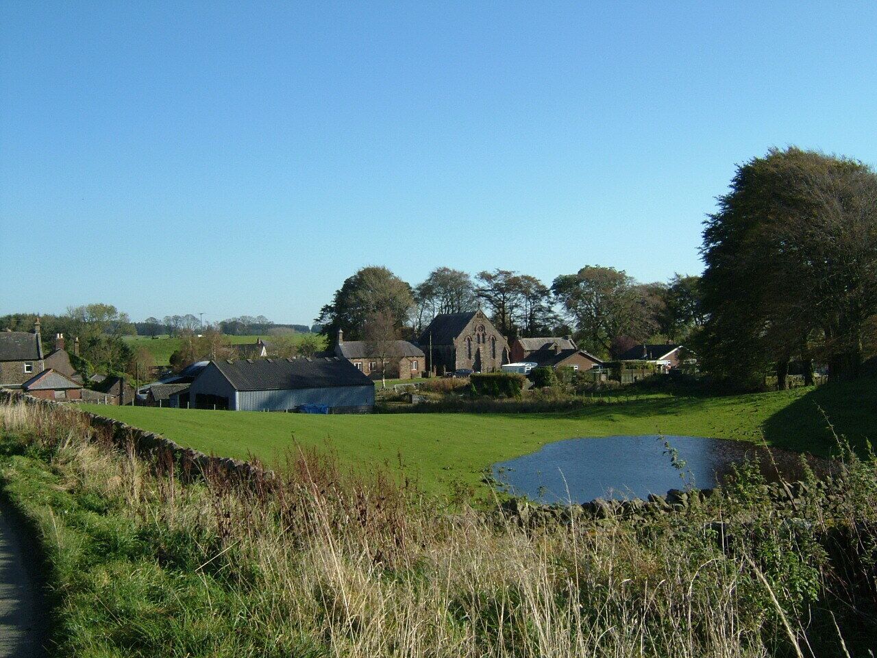 Hallbankgate a village in Cumbria on the A689 Brampton to Alston road. It is village with a mining tradition on the former 'Lord Carlisle's 1775 railway'. A wet field with a Methodist chapel behind
