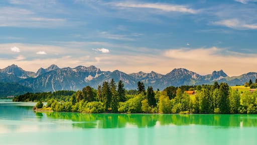 panoramic landscape in Bavaria with mountain range and lake