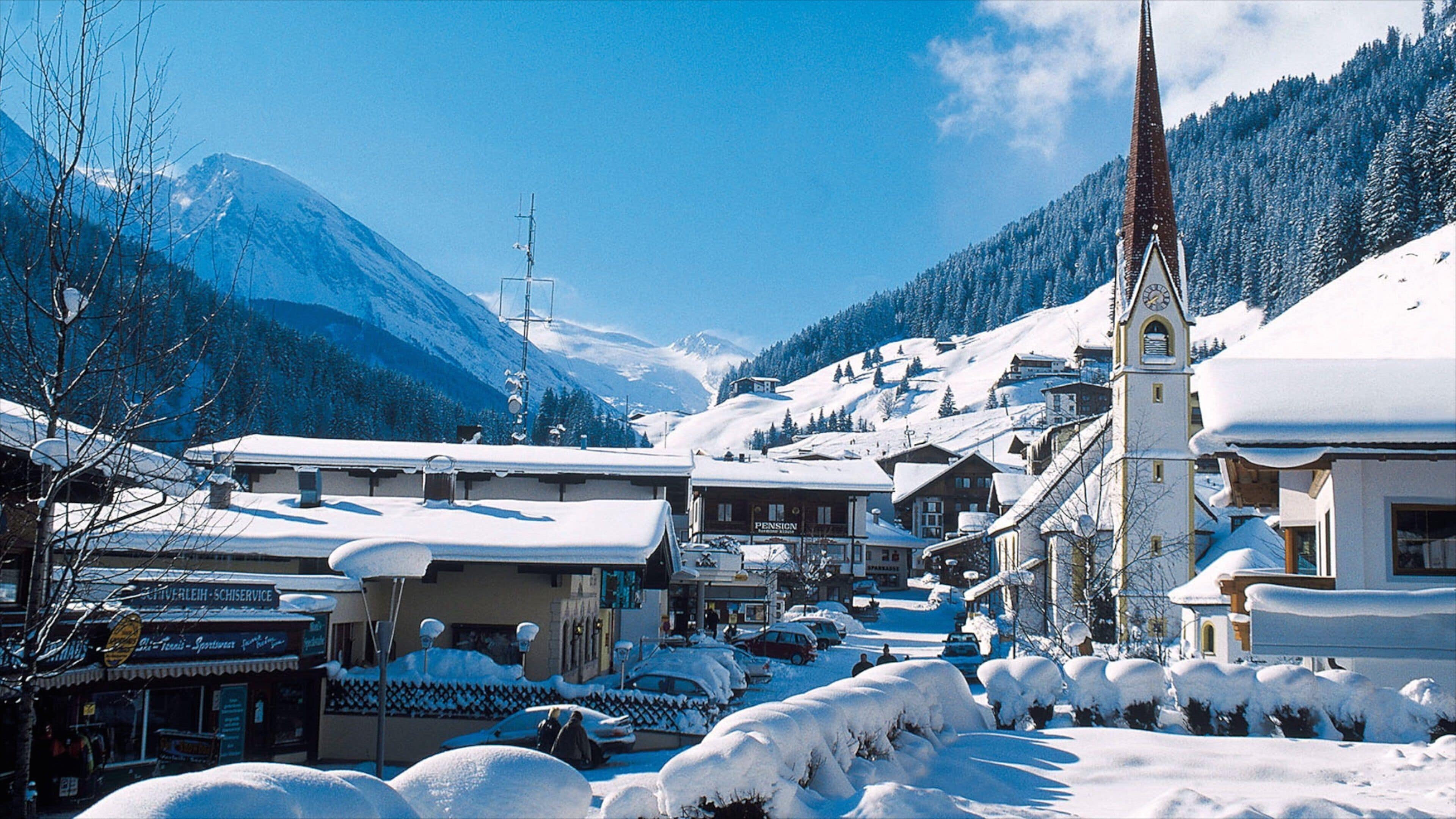 Hintertux featuring mountains, snow and a small town or village