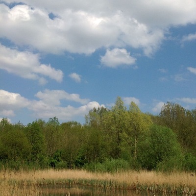 Mountainous clouds complete the otherwise flat Dutch landscape