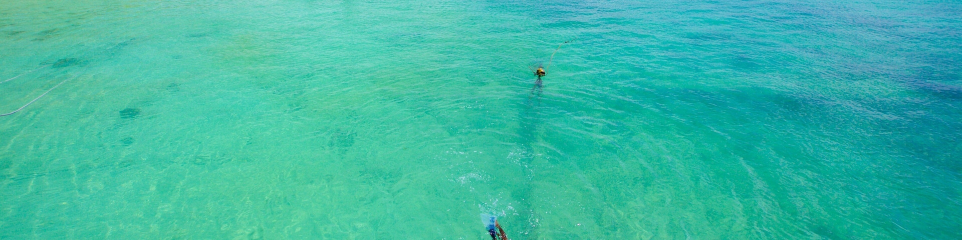 Trou aux Biches featuring boating and a sandy beach as well as an individual male