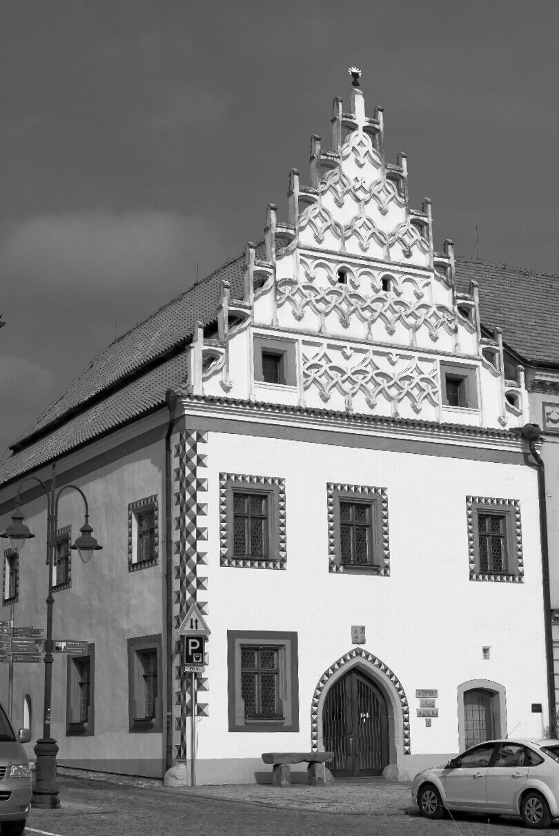 February 2016

House #6, Žižka's square, Tábor, Czech republic 

This well preserved house in Tábor's main square, called Ctibor's house, is a great example of late Gothic architecture. Built ca. 1532 it has a Gothic gable and illusive window and facade decoration imitating stone (a typical  Rennaisance feature). The gable is decorated in round shapes and little fire shapes (a late Gothic feature).
You can enjoy plentiful Gothic and Rennaisance styles in this lovely south Bohemian town. 