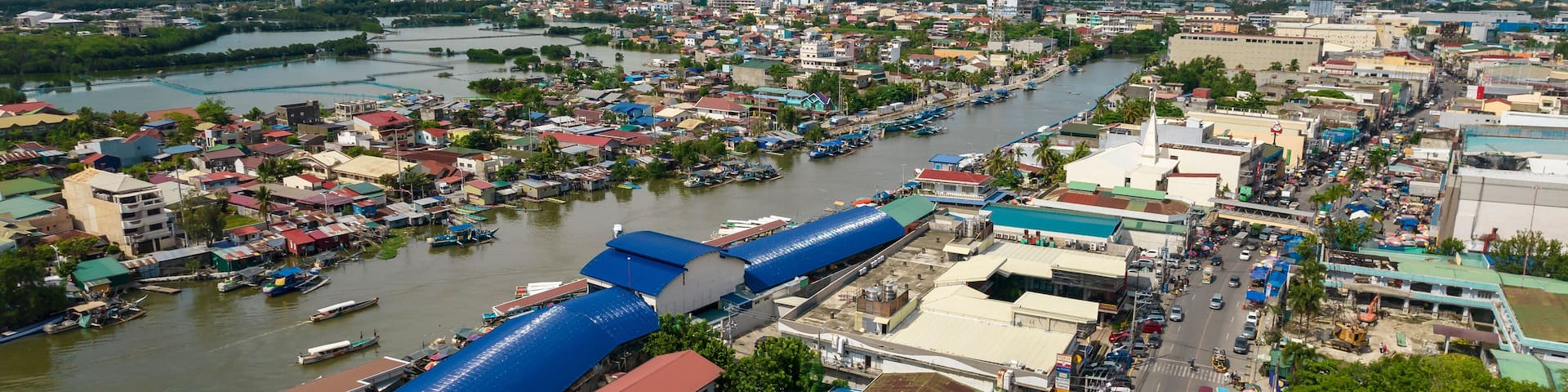 Dagupan, Pangasinan, Philippines - Aerial view of the fish market along Pantal River and the city of Dagupan.
