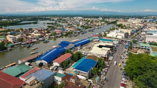 Dagupan, Pangasinan, Philippines - Aerial view of the fish market along Pantal River and the city of Dagupan.