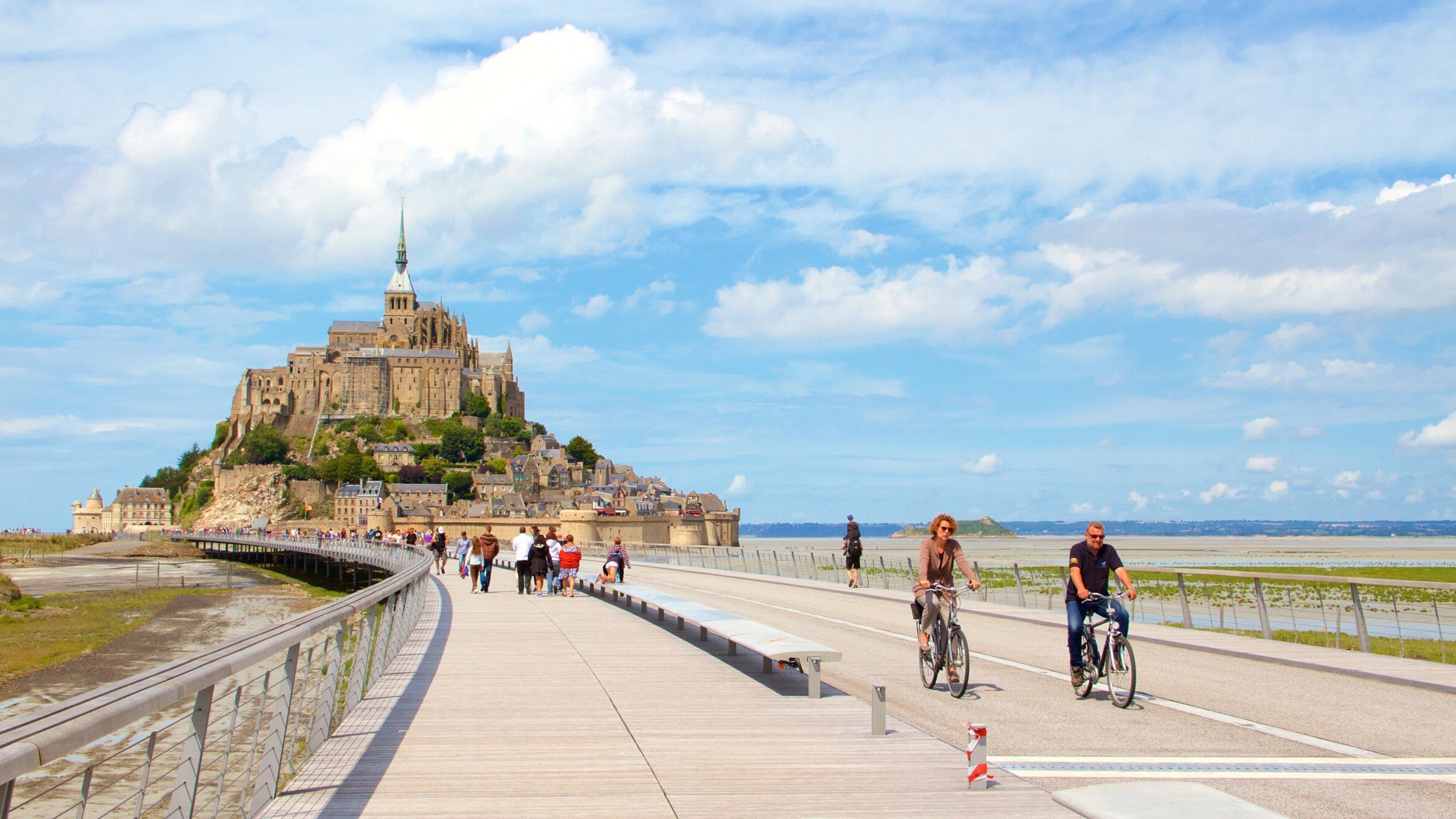 Le Mont-Saint-Michel which includes heritage elements and a small town or village as well as a couple