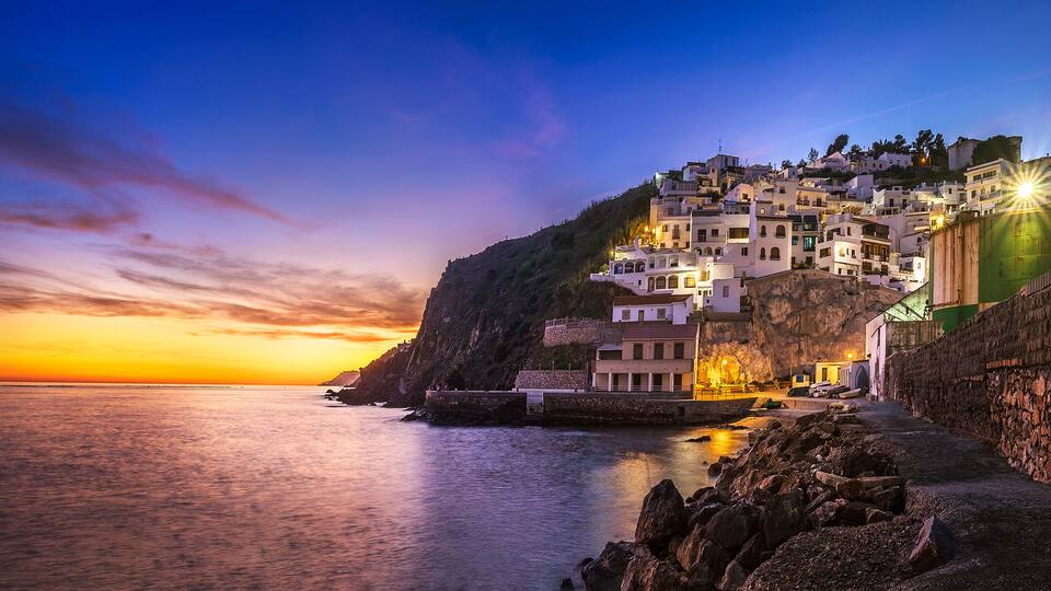 Panoramic view of La Caleta-Guardia little fishing port at dusk, Salobreña, Granada province, Andalusia, Spain