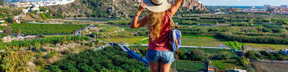 Tourist woman admiring the castle and white houses in Salobreña, Spain, Granada province