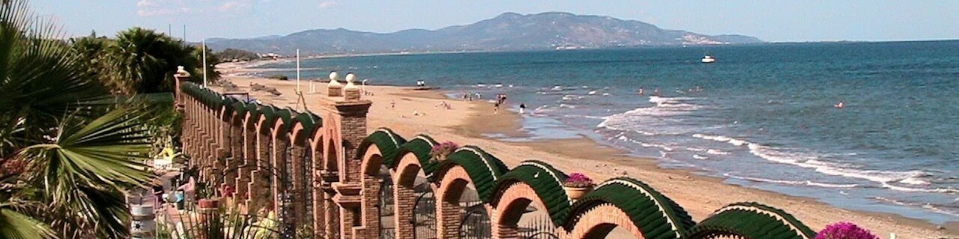 This is a a photo of a beach in the Land of Valencia, Spain, with id: