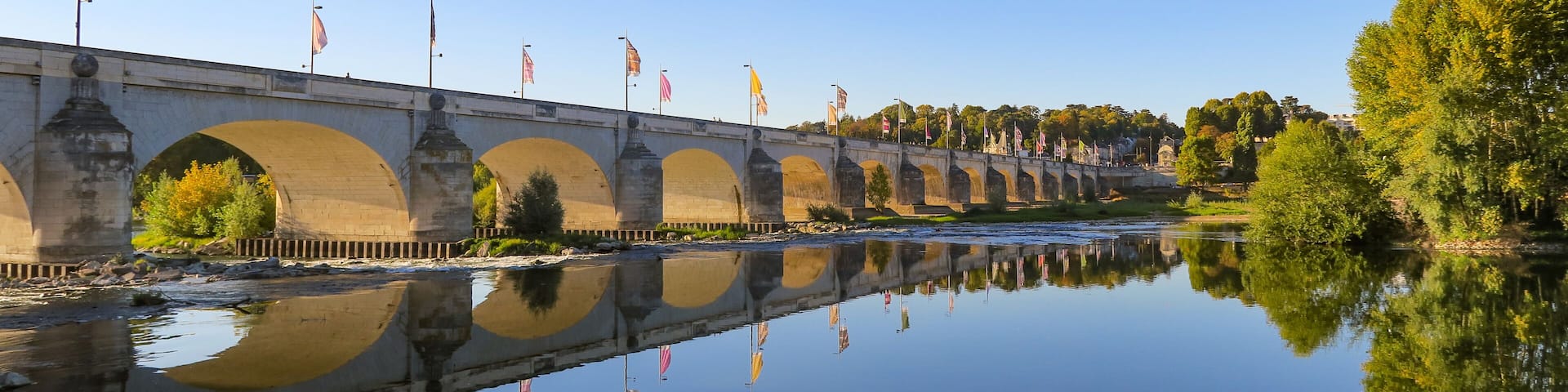 Beautiful view of the Wilson bridge and its reflection in the Loire river in Tours, France