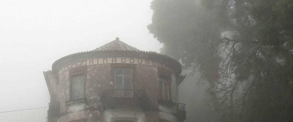 A foggy, dilapidated building with the sign 'MARADOU' on top.