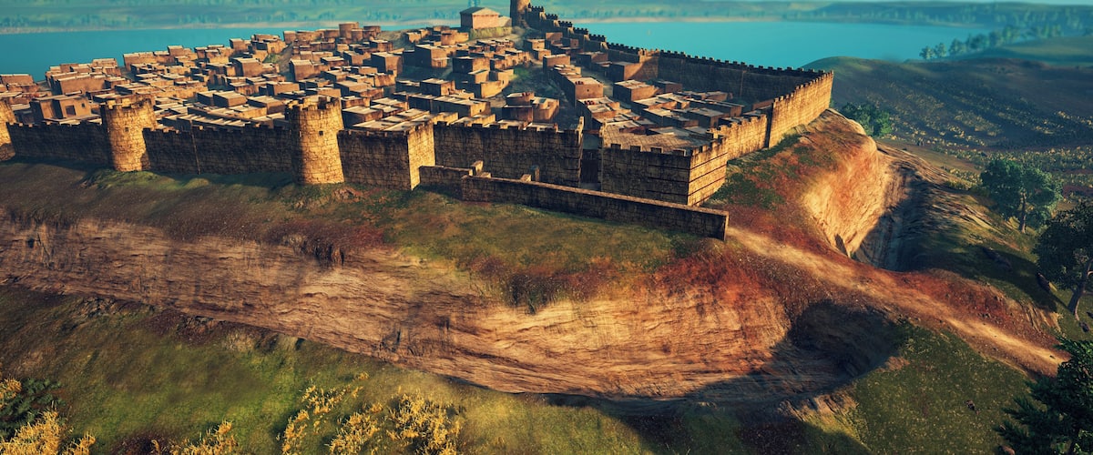 Accés principal al Puig de Sant Andreu. Es pot veure gran part de la muralla i el fossat excavat a la roca que servia per reforçar la defensa de tot el nucli habitat.