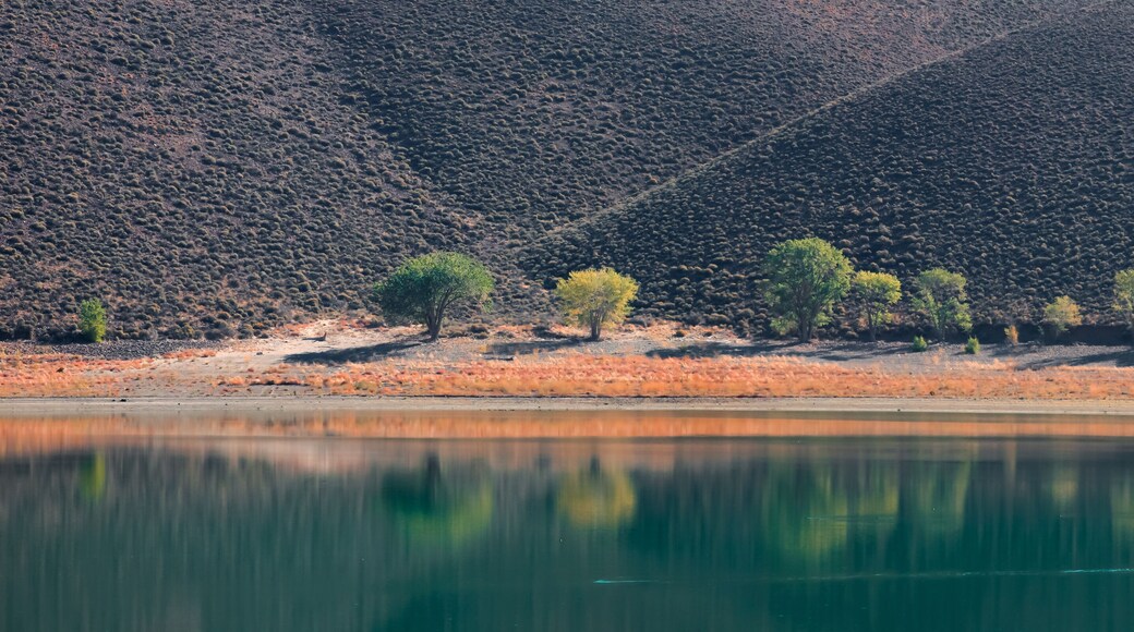 Perfect reflection at scenic Topaz lake in Sierra Nevada mountains, California.