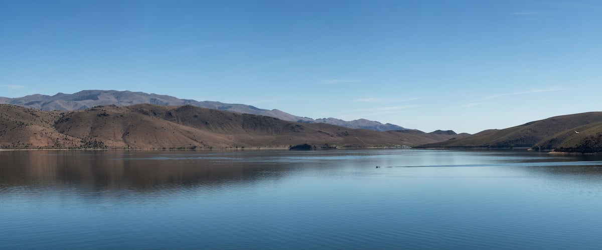 Panoramic View of Lake surrounded by Mountains on a Sunny Day. Summer Season. Topaz Lake, Nevada, United States. Near California. Nature Background. Panorama