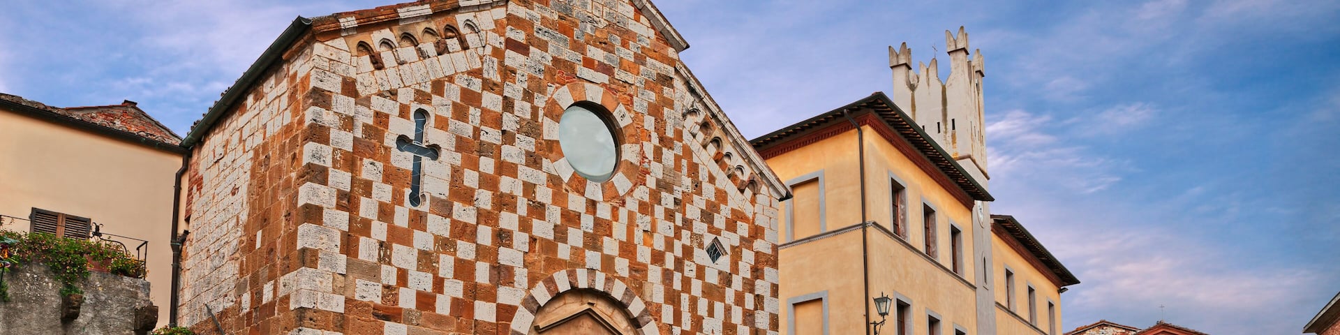 Trequanda, Siena, Tuscany, Italy: the ancient square with the medieval church and the town hall in the old town of the Tuscan village; Shutterstock ID 1473406058; Purchase Order: -