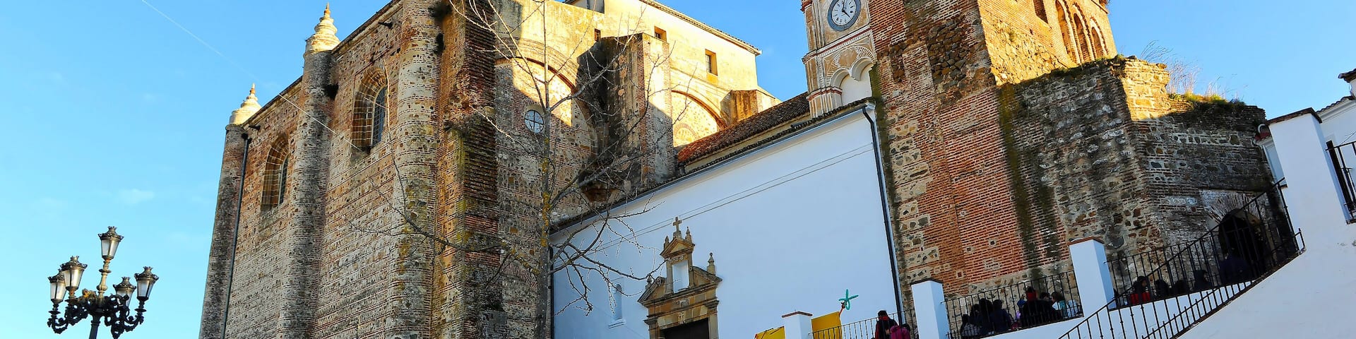 Main Plaza (Plaza Mayor) and Consolation church in Cazalla de la Sierra, a picturesque village in the province of Seville, Spain
