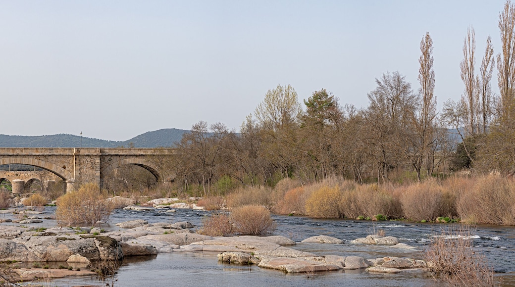 Congosto and medieval bridge with Castillo de los Dávila with the Tormes river in Guijuelo, Salamanca, Spain