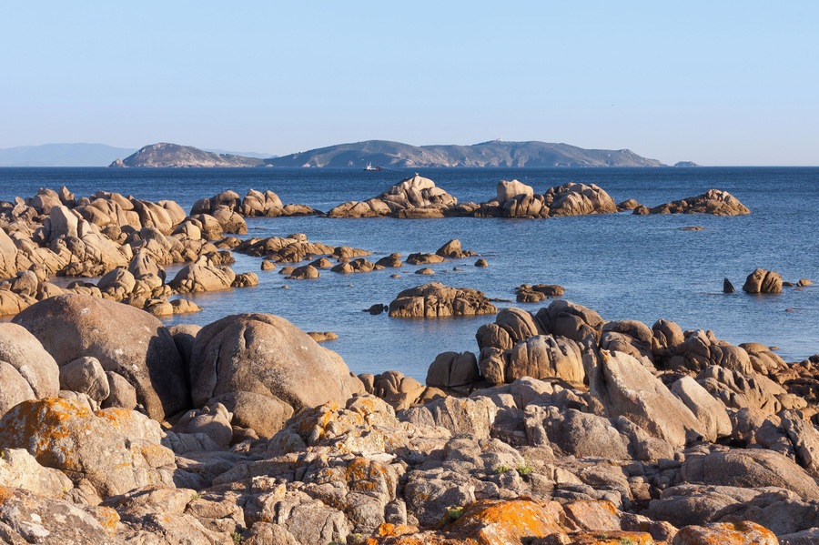 Sea and rocks in the ria of Pontevedra. Ons island at background. San Vicente do Mar, O Grove, Galicia, Spain.