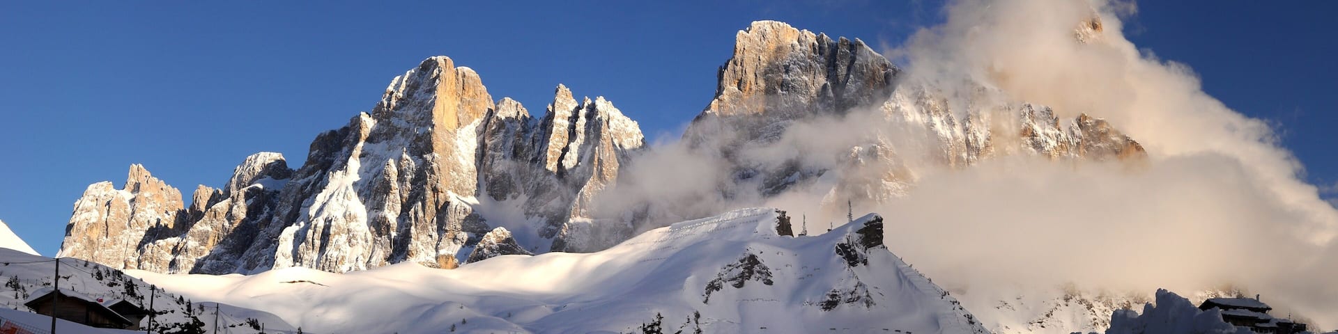 Beautiful view of Pale di San Martino in the italian Dolomites with blue cloudy sky. The famous Cimon della Pala as seen from Passo Rolle. Val di Fiemme, Italy.