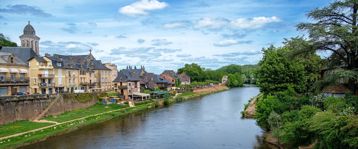 View over the Vézère River onto the old town of Montignac-Lascaux in Perigord, France