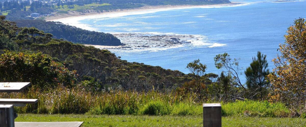 A sensational place to pull out the picnic rug.
Views are across to The Entrance and up to Norah Head and beyond.  
A popular place to spot the whales migrating.  Also a great little spot to see the local dolphins and the other flora and fauna.  A stunning walk up the coastline too.
One of those 'Local' kept secrets....