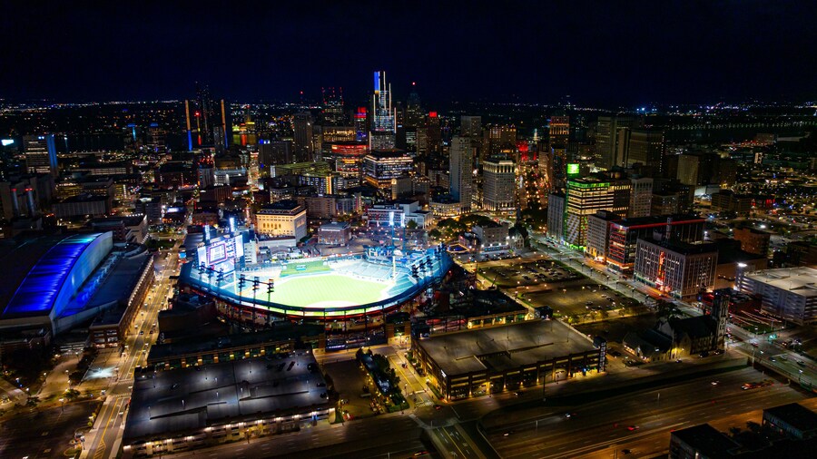 Comerica Park and Detroit skyline at night. Drone aerial photo of Comerica Park stadium and downtown Detroit skyline illuminated at night.