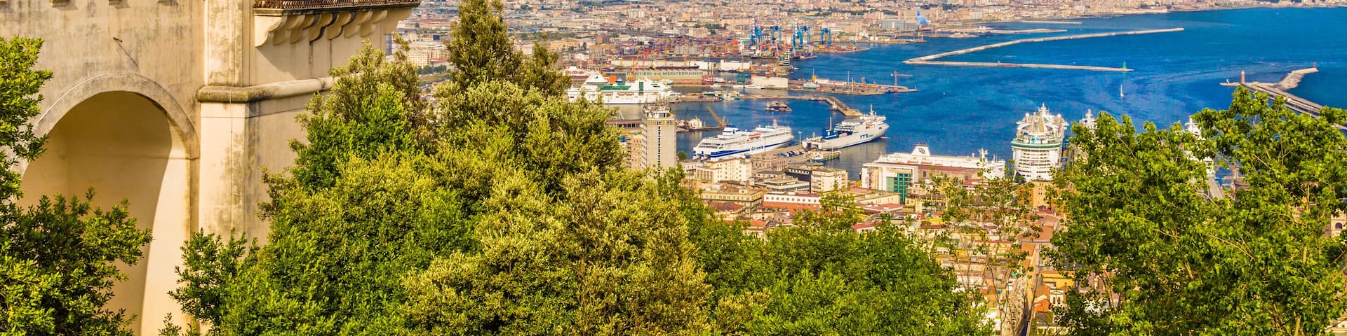 Scenic picture-postcard view of the city of Naples (Napoli) with famous Mount Vesuvius in the background from Certosa di San Martino monastery, Campania, Italy