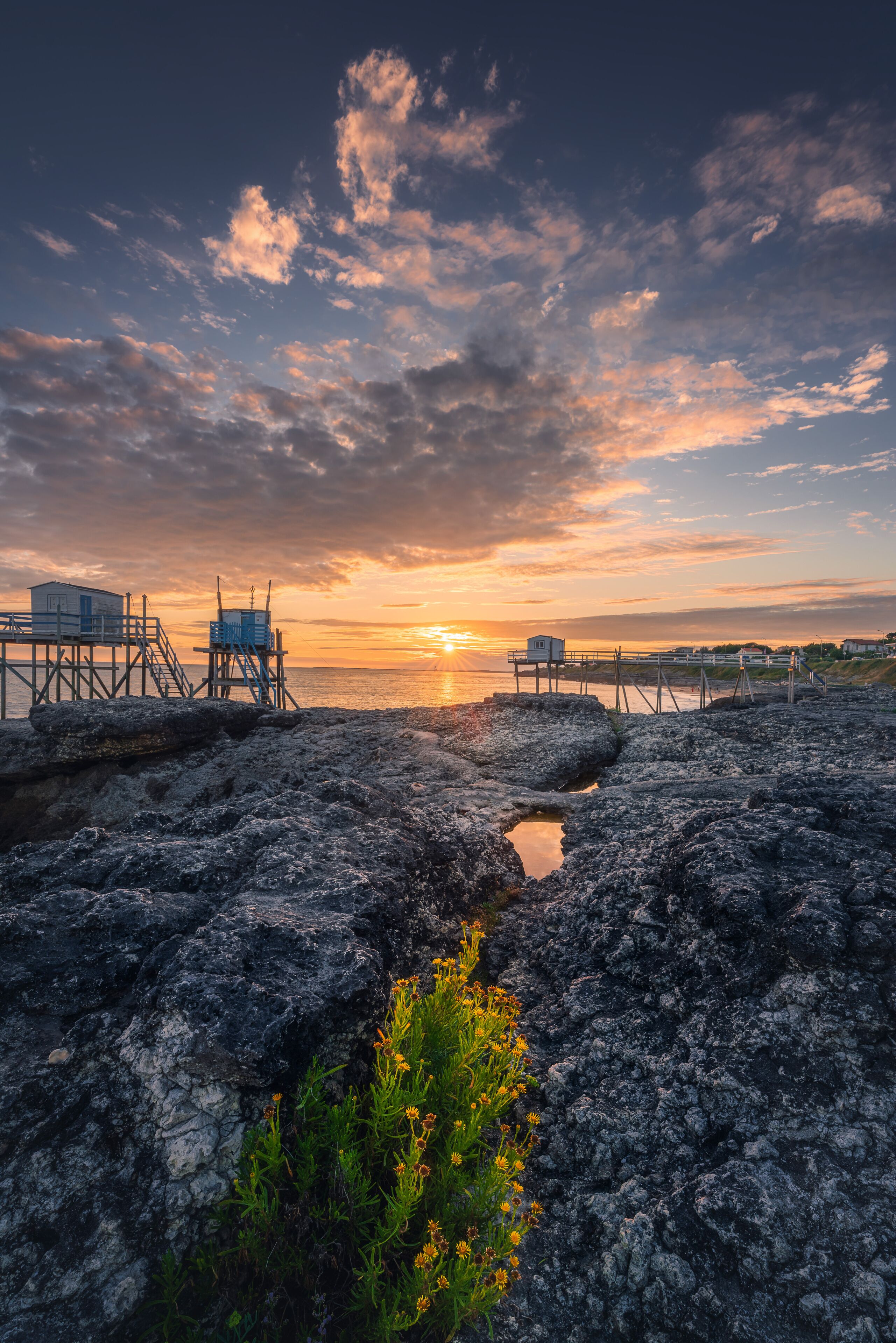 Sunset landscapes at the coastline of Saint-palais-sur-mer, with traditional carrelets along the sea in Charente-Maritime, France