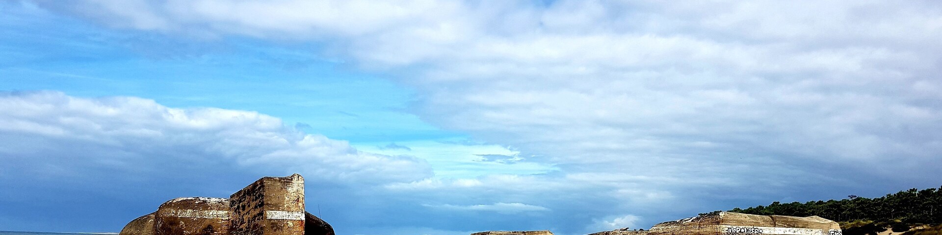 Long beautiful beach with remaining bunkers from WW2.