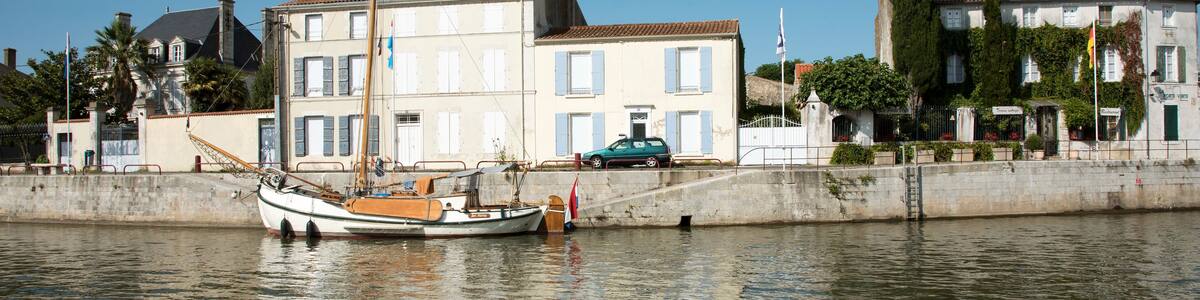 Marans a commune in the Charente Maritime region of Southwest France - August 2016 - The Canal de Marans La Rochelle at Morans with pleasure craft using the waterway