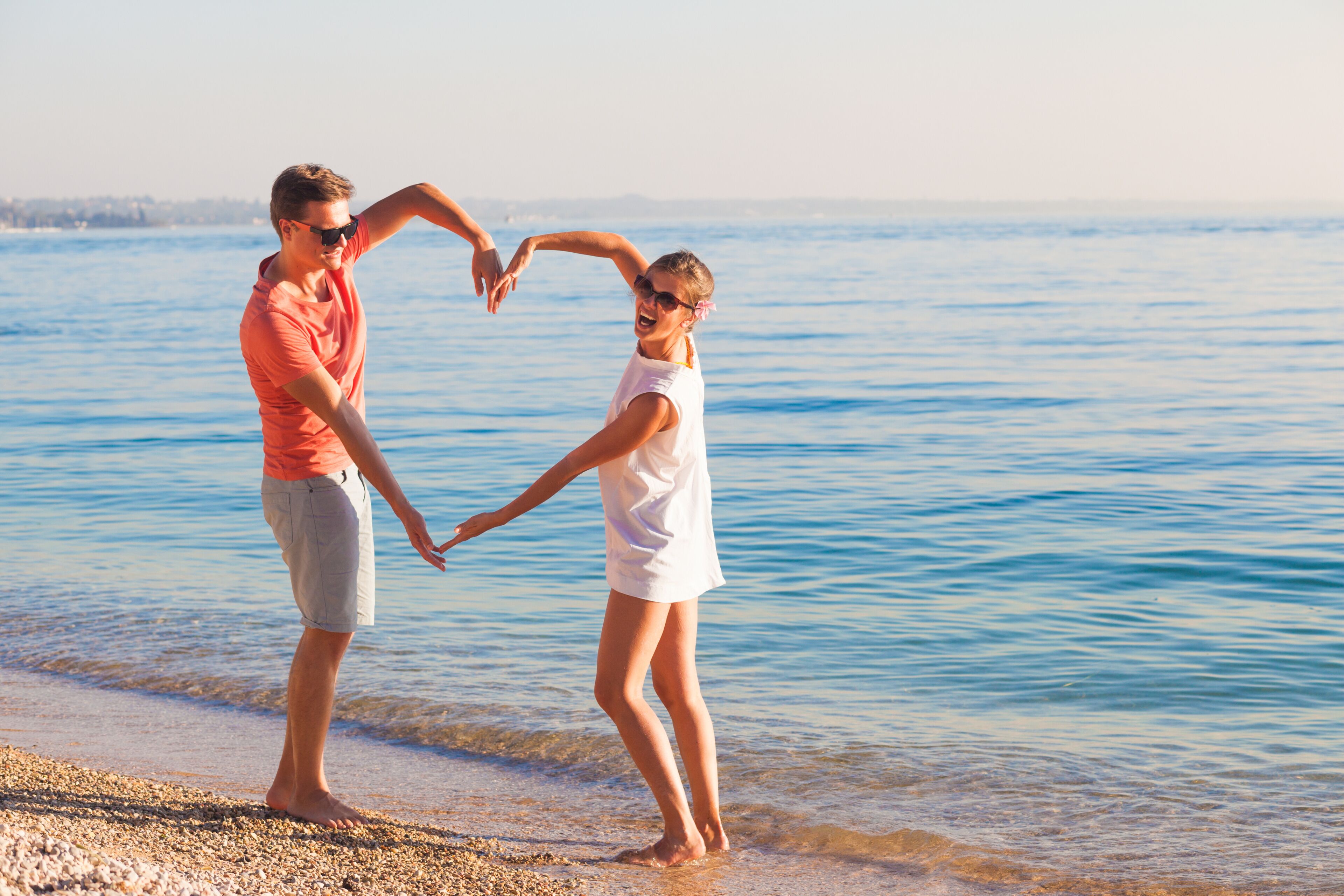 Happy young couple relaxing at Garda lake. Italy, Europe