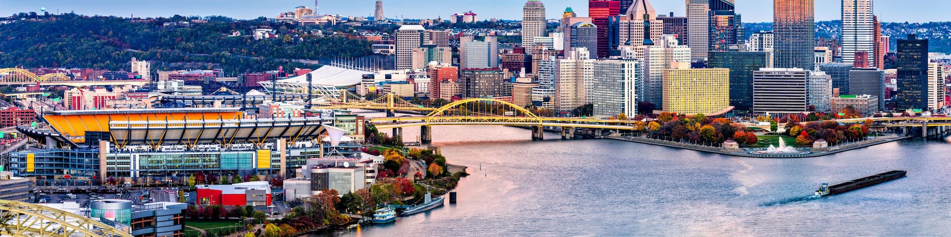 Pittsburgh, Pennsylvania skyline at sunset and the famous baseball stadium across Allegheny river