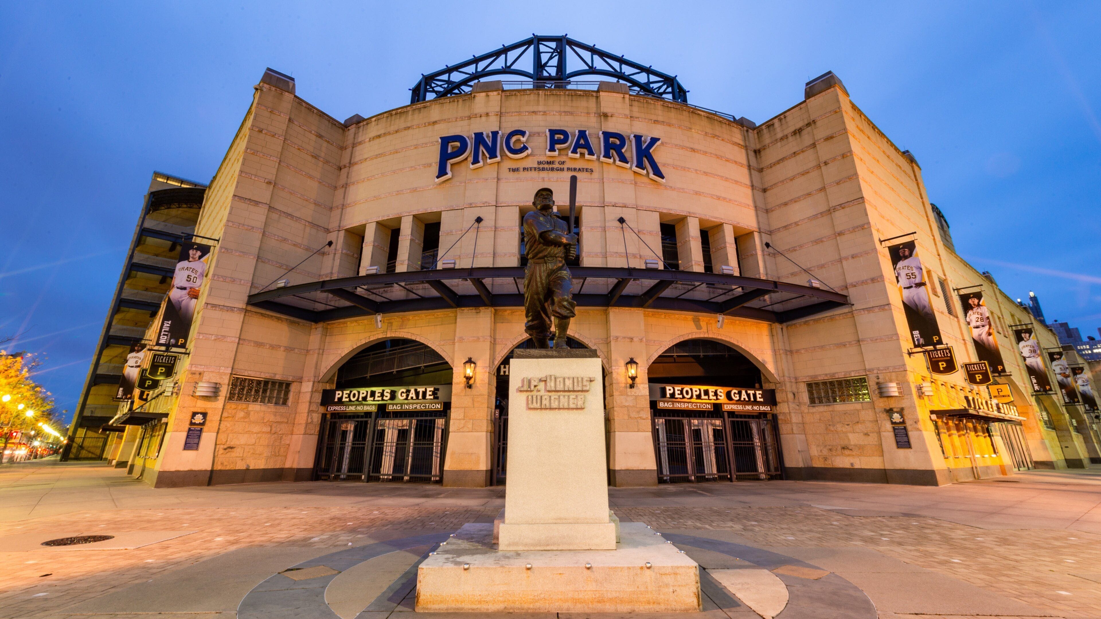 PNC Park featuring a statue or sculpture, night scenes and signage