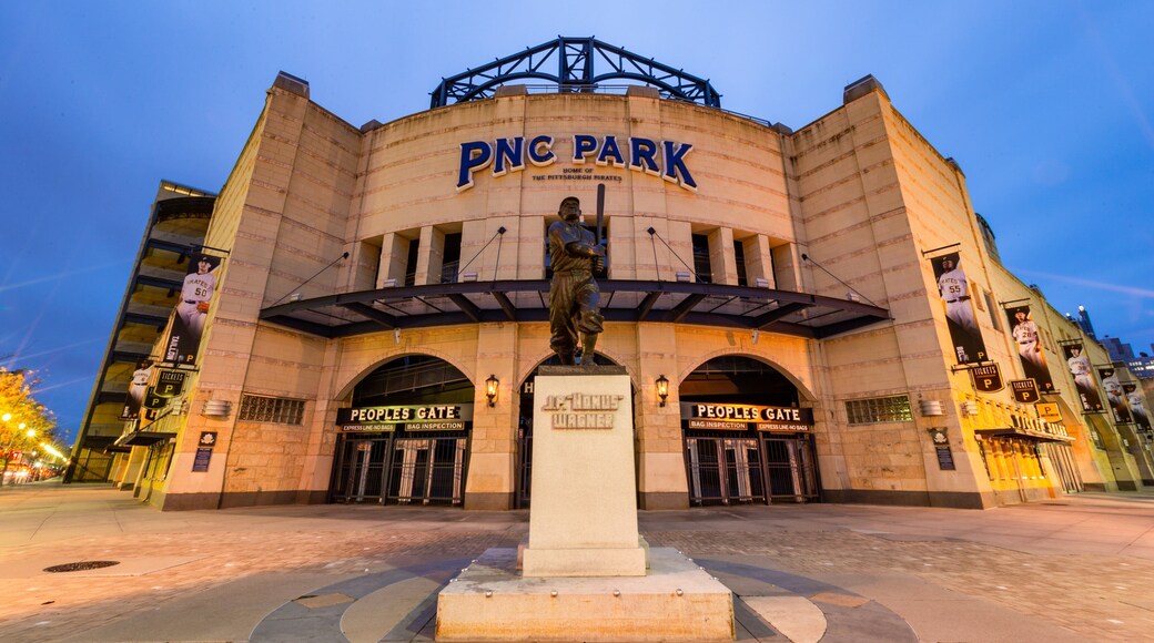 PNC Park featuring a statue or sculpture, night scenes and signage