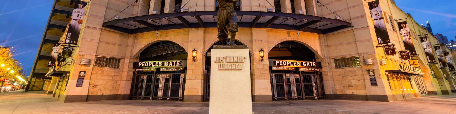 PNC Park featuring a statue or sculpture, night scenes and signage