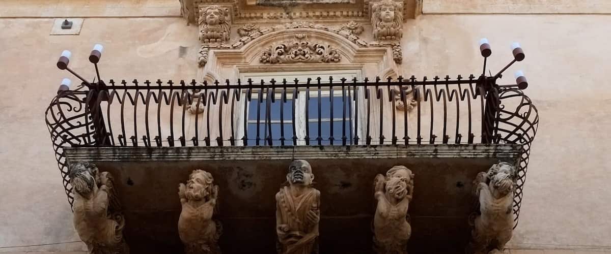 The striking facade of this 18th-century palace features wrought-iron balconies supported by a swirling pantomime of grotesque figures. Inside, the richly brocaded walls and frescoed ceilings offer an idea of the sumptuous lifestyle of Sicilian nobles, as brought to life in the Giuseppe Tomasi di Lampedusa novel Il Gattopardo