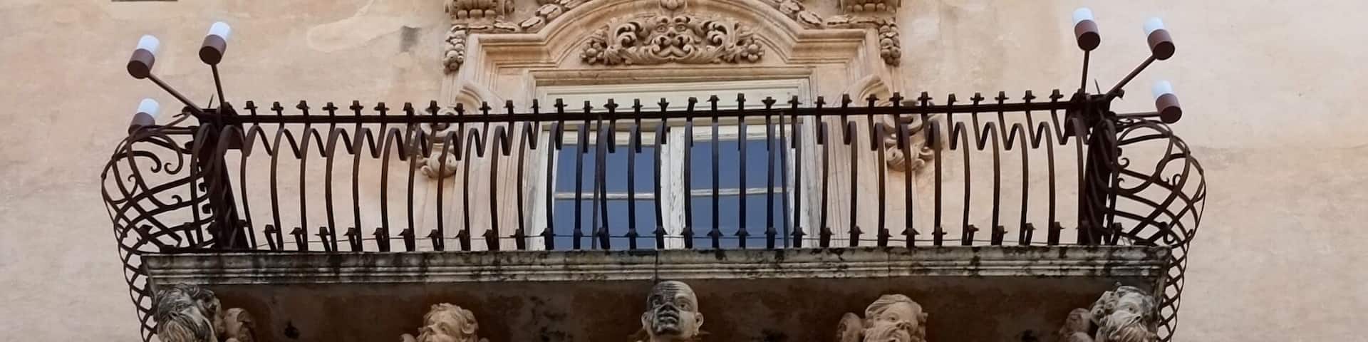 The striking facade of this 18th-century palace features wrought-iron balconies supported by a swirling pantomime of grotesque figures. Inside, the richly brocaded walls and frescoed ceilings offer an idea of the sumptuous lifestyle of Sicilian nobles, as brought to life in the Giuseppe Tomasi di Lampedusa novel Il Gattopardo