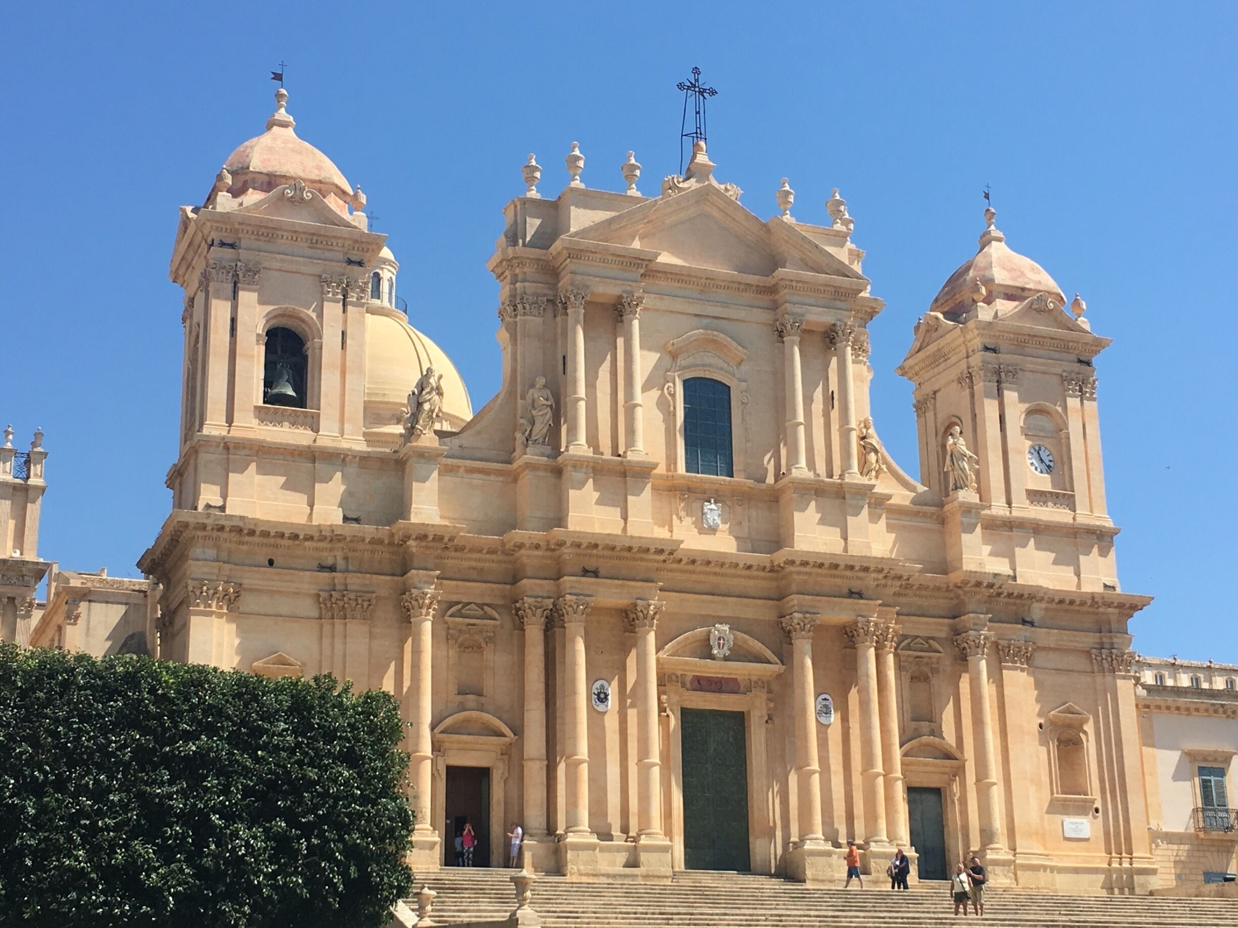 A large, ornate church with multiple domes and bell towers.