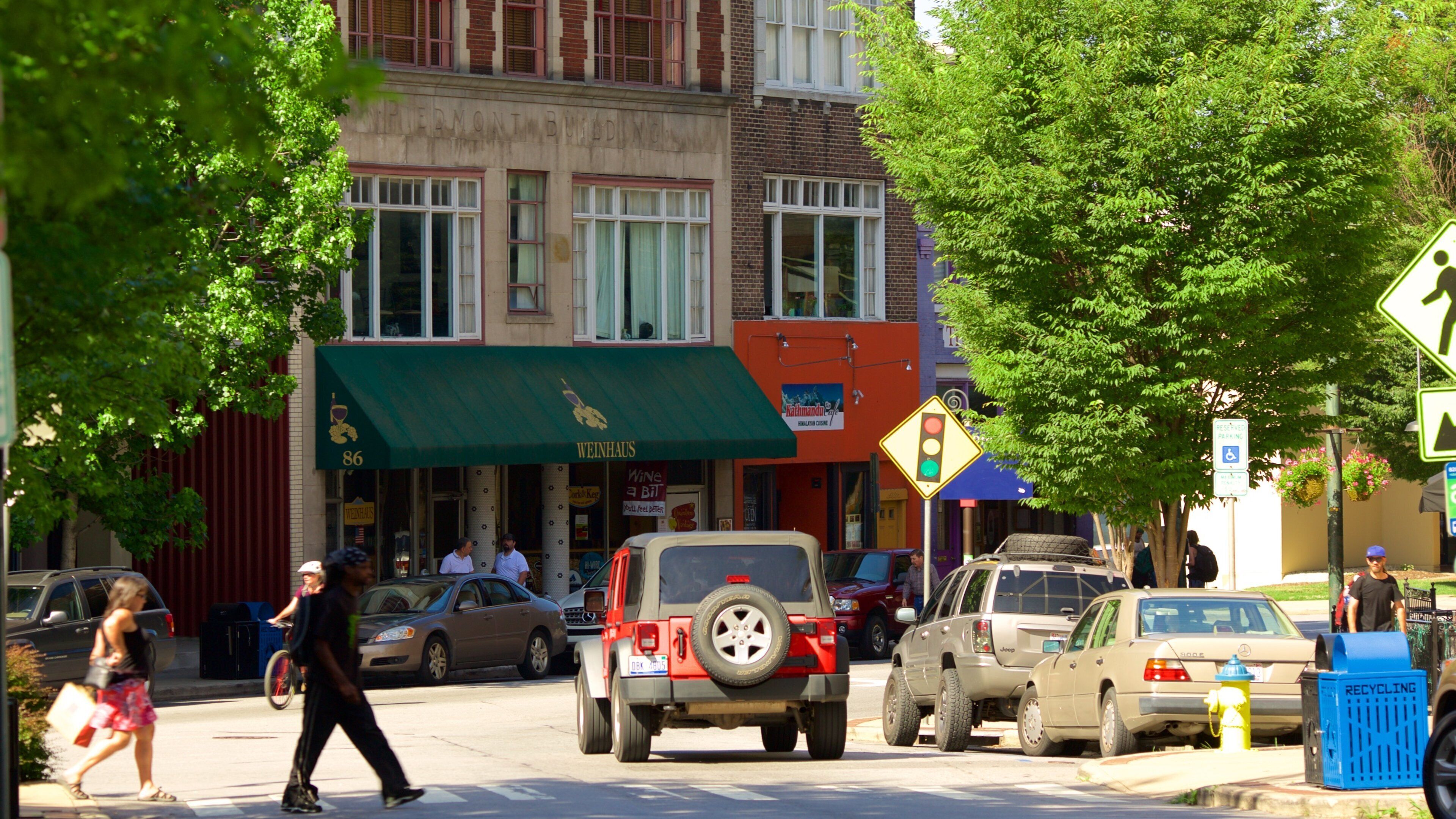 Asheville showing street scenes and a city as well as a small group of people