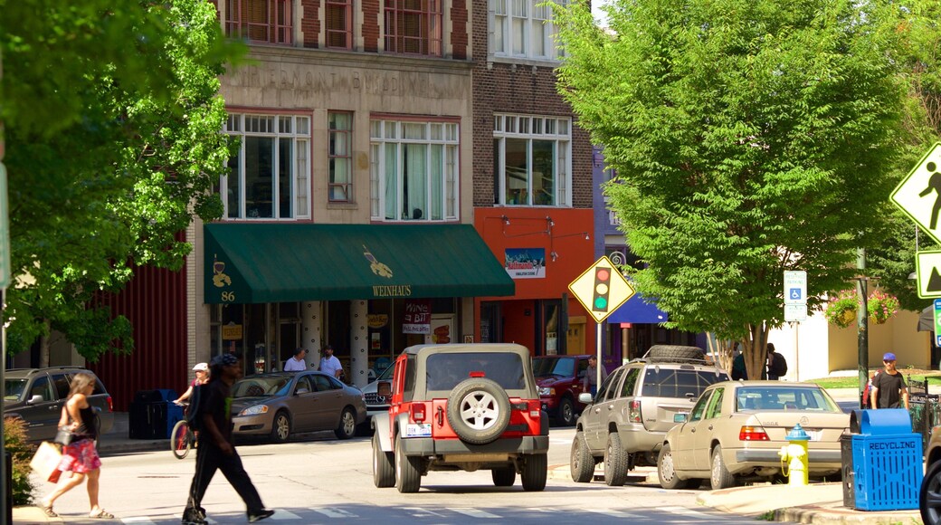 Asheville showing street scenes and a city as well as a small group of people