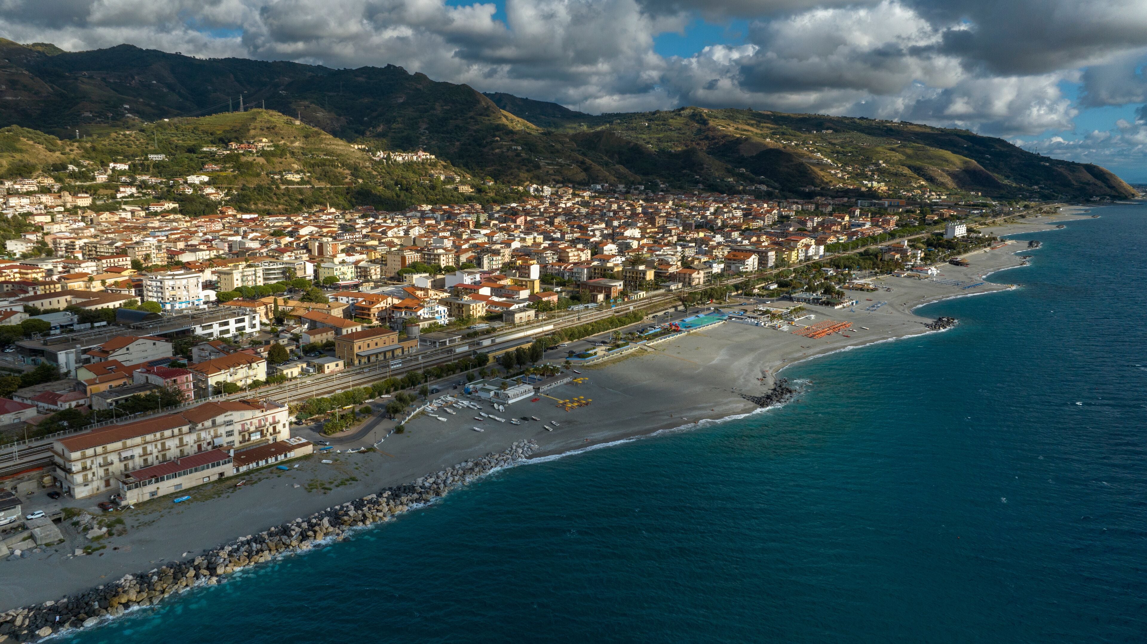 Aerial view of the Amantea seafront, located in the province of Cosenza, Calabria, Italy. It is a popular summer tourist destination with its coastline overlooking the Tyrrhenian Sea.