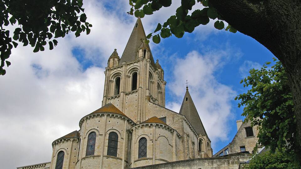 A historic cathedral with multiple spires and arched windows.