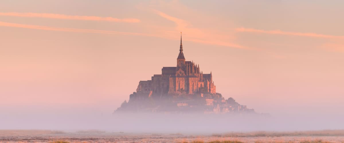 Le Mont Saint Michel in Normandy, France at sunrise