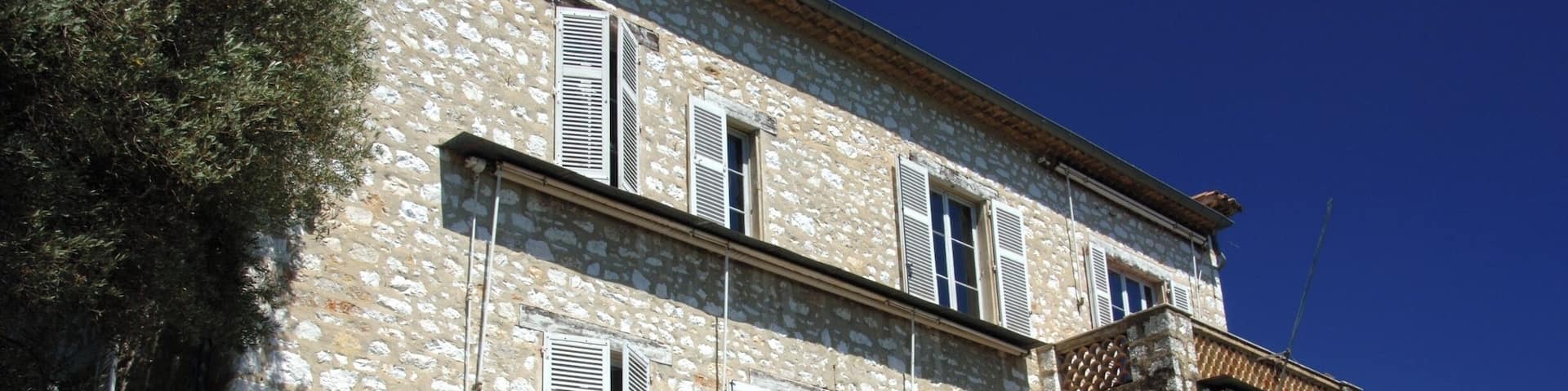 The Renoir Museum in Cagnes-sur-Mer, Cote d'Azur. In 1907 the Impressionist painter, Pierre Auguste Renoir, bought Les Collettes, a pretty pale stone farmhouse set in a garden of olive trees looking out over the sparkling blue of the Mediterranean Sea. Like others, he had fallen in love with the clear colors and the quality of light of the south of France.