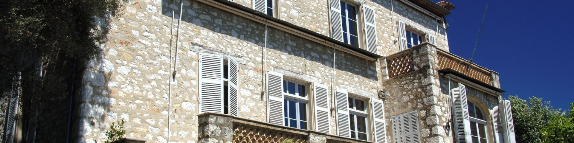 The Renoir Museum in Cagnes-sur-Mer, Cote d'Azur. In 1907 the Impressionist painter, Pierre Auguste Renoir, bought Les Collettes, a pretty pale stone farmhouse set in a garden of olive trees looking out over the sparkling blue of the Mediterranean Sea. Like others, he had fallen in love with the clear colors and the quality of light of the south of France.