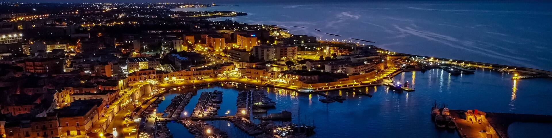 Aerial view of the port of Bisceglie at night - Historic marina in the south of Italy, in the region of Apulia, near the Adriatic Sea