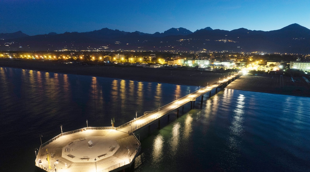 Night aerial view of the pier of Marina di Pietrasanta Tuscany Italy